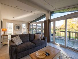 A living room with a sofa and coffee table at Wentworth in Waltham