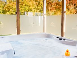 A hot tub with a duck toy on the edge at Royal View in Waltham