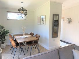 A dining room with a table and chairs at Royal View in Waltham