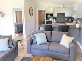 A living room with a sofa and coffee table at Royal View in Waltham