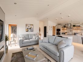 A living room featuring sofas and a coffee table at The Luxury Hideaway in Waltham