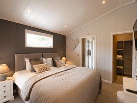 A bedroom with a bed and closet at The Luxury Hideaway in Waltham