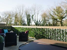 An outdoor area with seating and greenery at The Henley in Waltham