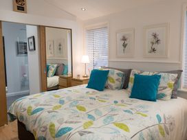 A bedroom with a bed and bedside table at The Royal in Waltham