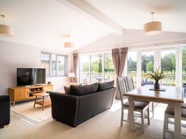A living room with a sofa and television at The View in Waltham