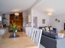 A living room and kitchen area with furniture at The View in Waltham