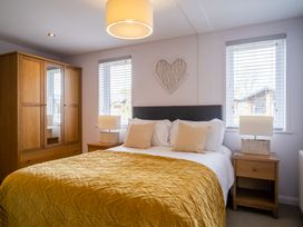 A bedroom with a bed and wardrobe at The View in Waltham
