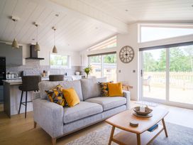 A living room with a sofa and coffee table at The Luxury Retreat in Waltham