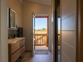 A bathroom with a sink and towel radiator at Exclusive Aura Spa Waltham
