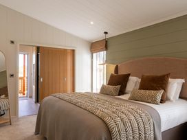 A bedroom with a bed and pillows at Exclusive Aura Spa Waltham