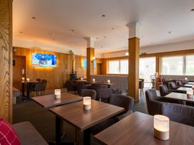 A dining room with tables and chairs at Luxury Boutique Retreat Pet in Waltham