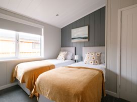 A bedroom with two beds and a window at Marrakech in Waltham