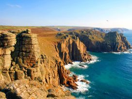 A coastal view of cliffs and ocean at St Ives Lodge 2 Spa in Praze-An-Beeble