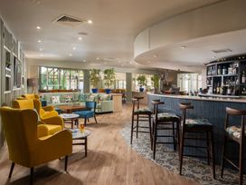 A lounge with seating and a bar at St Ives Lodge 3 Spa in Praze-An-Beeble