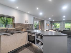 A kitchen with a sink and stove at St Austell Lodge Spa in Praze-An-Beeble