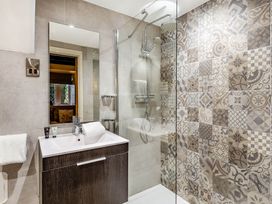 A bathroom with a shower and sink at The Gatehouse in Praze-An-Beeble