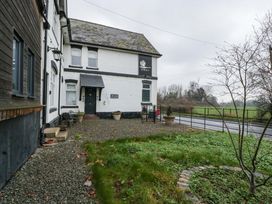 An outdoor view of a building with a sign at The Swan in 