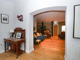 A living room with a sofa and armchairs at The Swan