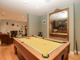 A recreation room with a pool table at The Swan