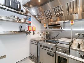 A kitchen with a cooking range and oven at The Swan in 