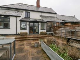 An outdoor area with patio and steps at The Swan