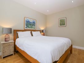 A bedroom with a bed and bedside tables at The Swan Whitney-On-Wye