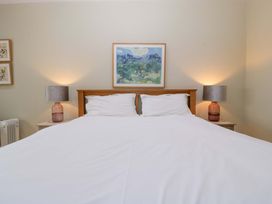 A bedroom with a bed and lamps at The Swan in Whitney-On-Wye