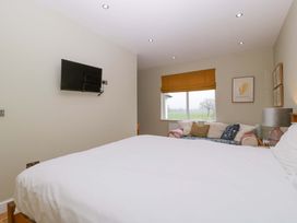 A bedroom with a bed and a television at The Swan in Whitney-On-Wye