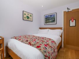 A bedroom with a bed and wall art at The Swan in Whitney-On-Wye