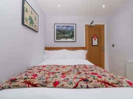 A bedroom with a bed and a door at The Swan in Whitney-On-Wye