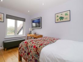 A bedroom with a bed and bedside table at The Swan in Whitney-On-Wye