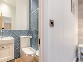 A bathroom with shower and toilet at Milk Wood 2 in Laugharne