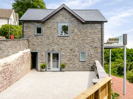 A house with a deck and garden area at The View in Laugharne