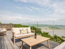 A terrace with outdoor furniture and a view at The View in Laugharne