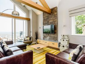 A living room with a sofa and coffee table at The View in Laugharne