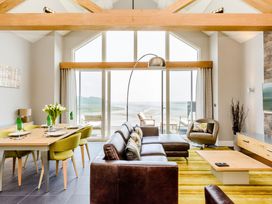 A living room and dining area with a view at The View in Laugharne