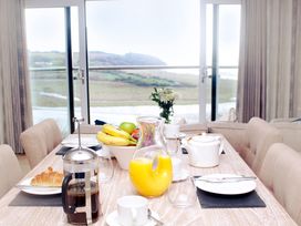 A dining room with a table set for breakfast at Milk Wood 3 Spa in Laugharne
