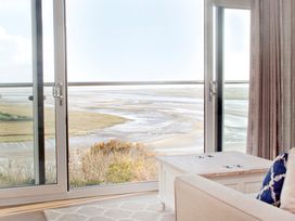 A living room with a view of the landscape at Milk Wood 3 Spa Laugharne