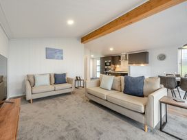 A living room with a sofa and coffee table at Sonnet 3 Spa (Pet) (Roof Terrace) in Laugharne