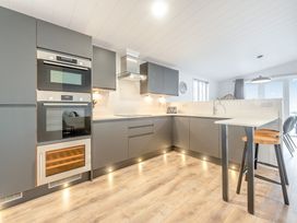 A kitchen with modern appliances and a countertop at Sonnet 3 Laugharne