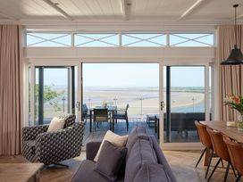 A living room with a view and furniture at Canto Spa (pet) Laugharne