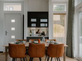 A dining room with a table and chairs at Wilde in Laugharne
