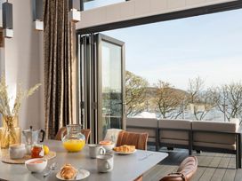 A dining room with breakfast items on the table at Solace in Laugharne