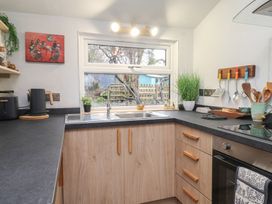 A kitchen with a sink and countertop at 20 Chatham Log Cabins Caernarfon