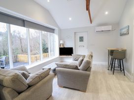 A living room with a sofa and television at Lodge at Nadur