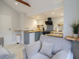 A kitchen with a sofa and various appliances at Lodge at Nadur