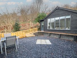 An outdoor space with a house and furniture at Lodge at Nadur