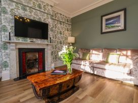 A living room with a sofa and coffee table at Sunnyvale House in Whitby