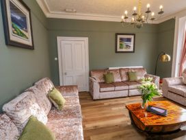 A living room with a sofa and coffee table at Sunnyvale House in Whitby