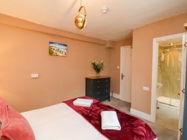 A bedroom with a bed and chest of drawers at Sunnyvale House in Whitby